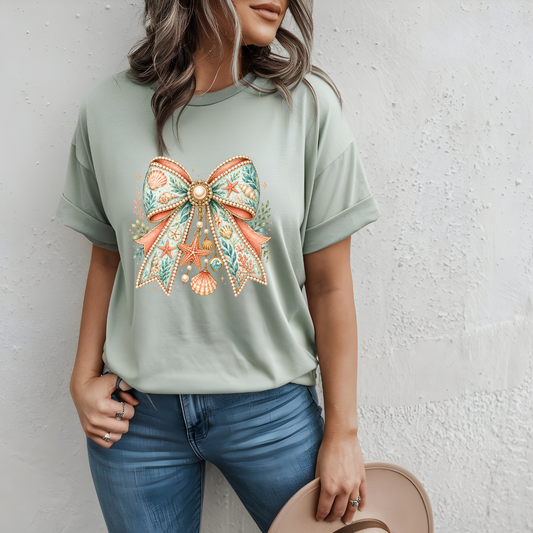 Coastal Seashell Bow Graphic Tee – Elegant Beachy Summer Shirt